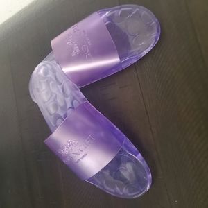 From COACH, the Ulyssa Water-Resistant Jelly Pool Slides